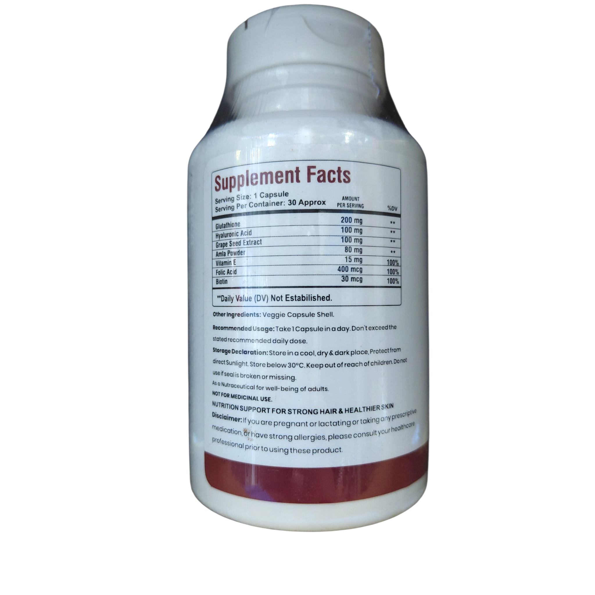 Abhiram Ayurveda Hair, Nail & Skin Supplement bottle with label, showcasing natural herbal ingredients and product packaging.